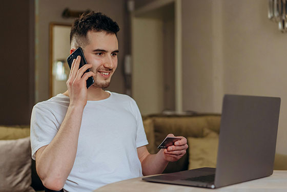 debt consolidation free consultation man happy on phone